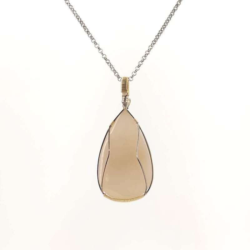 Necklace with a teardrop-shaped drusy agate pendant set in a sterling silver and Gold Filled Wire wrap and bail, on a white background (back view)