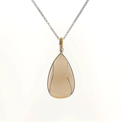 Necklace with a teardrop-shaped drusy agate pendant set in a sterling silver and Gold Filled Wire wrap and bail, on a white background (back view)
