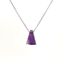 Amethyst gemstone pendant showcasing the stone’s rich purple hue, against a white background.