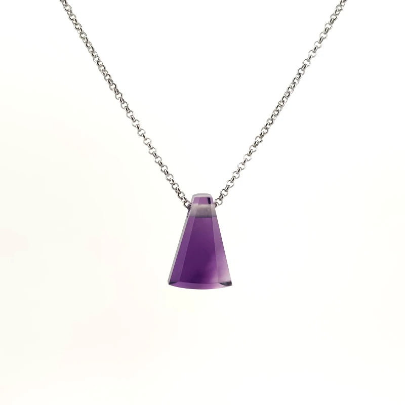 Amethyst gemstone pendant showcasing the stone’s rich purple hue, against a white background.