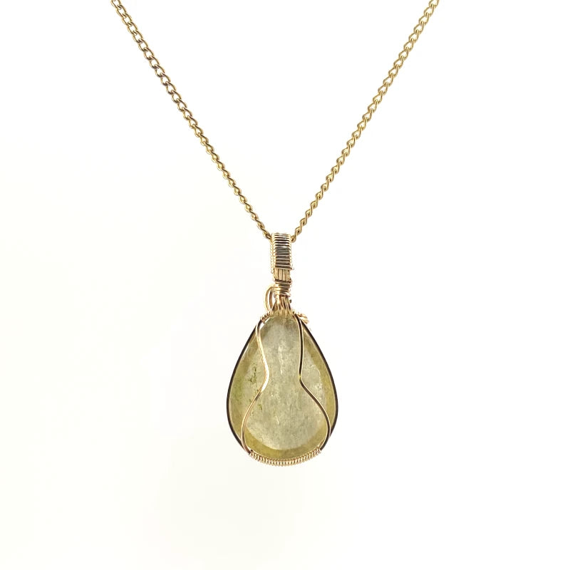 Necklace with a teardrop-shaped Golden Mica pendant showcasing shimmering golden layers that reflect light, with 14K Gold Filled Wire wrapped and bail, on a white background (back  view)
