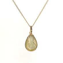 Necklace with a teardrop-shaped Golden Mica pendant showcasing shimmering golden layers that reflect light, with 14K Gold Filled Wire wrapped and bail, on a white background (back  view)