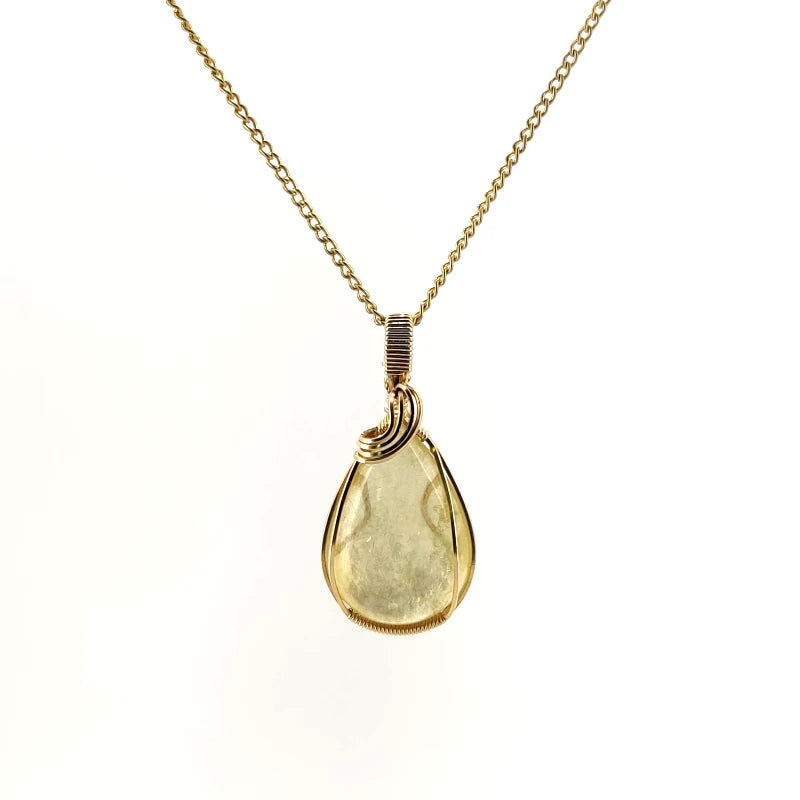 Necklace with a teardrop-shaped Golden Mica pendant showcasing shimmering golden layers that reflect light, with 14K Gold Filled Wire wrapped and bail, on a white background (front view)