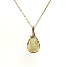 Necklace with a teardrop-shaped Golden Mica pendant showcasing shimmering golden layers that reflect light, with 14K Gold Filled Wire wrapped and bail, on a white background (front view)