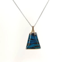 Necklace with a triangular Chrysocolla pendant featuring vibrant shades of blue and green with natural patterns, paired with Sterling Silver and Gold Filled Wire wrap and bail (back view)