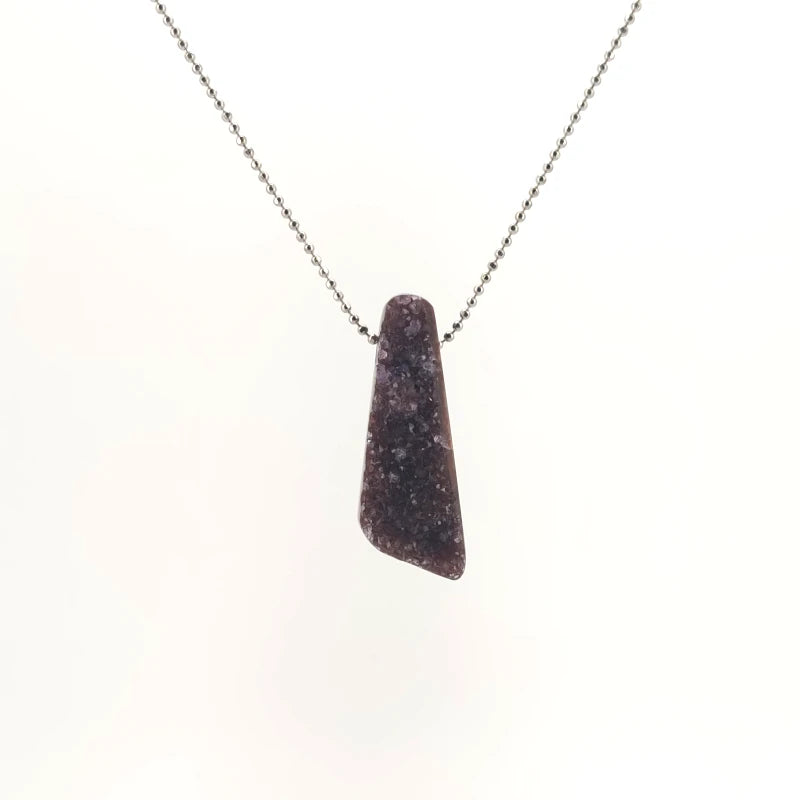 Necklace with a Drusy Amethyst pendant sparkles with tiny crystal formations on a natural surface, on a white background (front view)