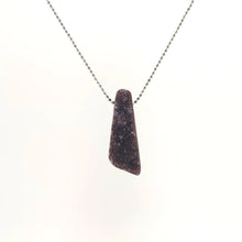Necklace with a Drusy Amethyst pendant sparkles with tiny crystal formations on a natural surface, on a white background (front view)