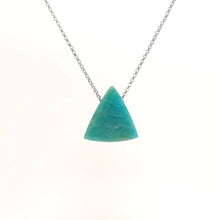 Triangle cut amazonite pendant with natural shades of blue-green on a silver chain against a white background (back view)