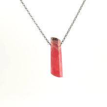 Necklace with a Rhodochrosite pendant displaying soft pink to rose-red tones with natural banding, on a white background (front view)