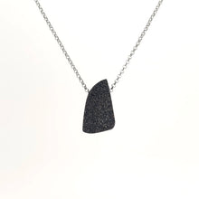 Necklace with a Rutilated Quartz pendant , on a white background (back view)