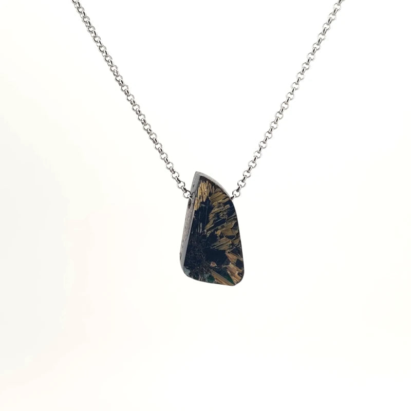 Necklace with a Rutilated Quartz pendant showcasing golden needle-like inclusions within clear quartz, on a white background (front view)