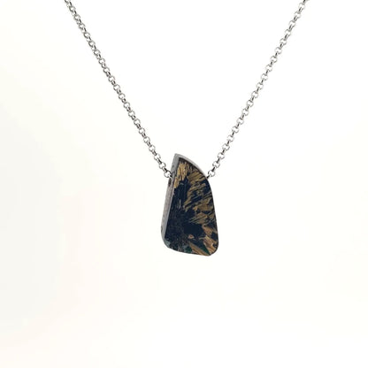 Necklace with a Rutilated Quartz pendant showcasing golden needle-like inclusions within clear quartz, on a white background (front view)