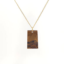 Necklace with a Mara Mamba Tiger Eye pendant featuring rich blends of gold, brown, and black tones, on a white background (back view)