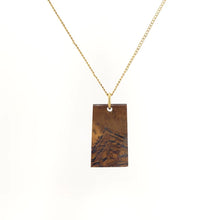 Necklace with a Mara Mamba Tiger Eye pendant featuring rich blends of gold, brown, and black tones, on a white background (front view)