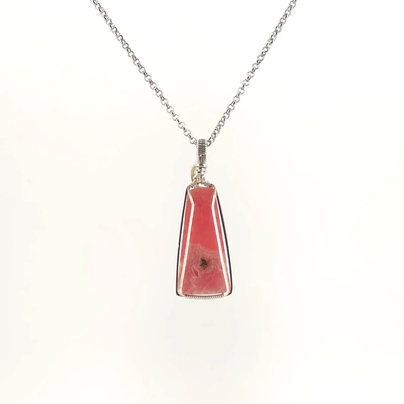 Necklace with Rhodochrosite pendant set in sterling silver wire wrap and bail, on a white background (back view)