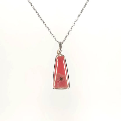 Necklace with Rhodochrosite pendant set in sterling silver wire wrap and bail, on a white background (back view)