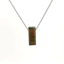 Necklace with a rectangular ammolite gemstone pendant featuring a striking display of natural iridescent colors (front view)