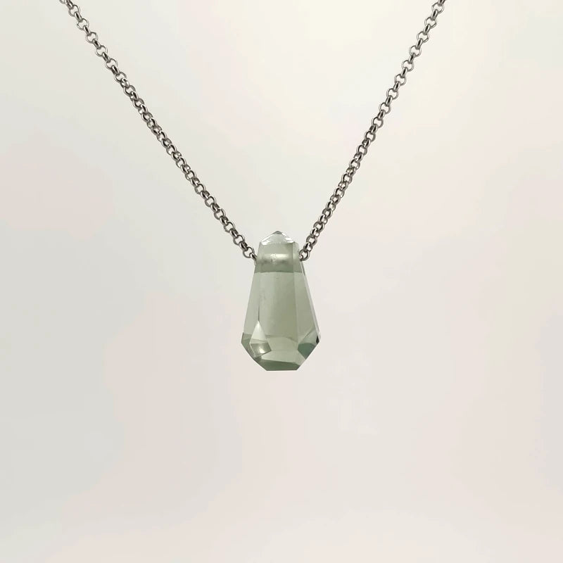 Necklace with a faceted Prasiolite pendant featuring soft green tones, on a white background (back view)