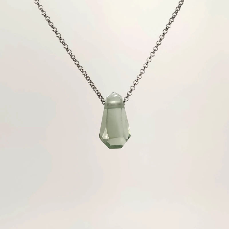 Necklace with a faceted Prasiolite pendant featuring soft green tones, on a white background (front view)