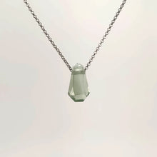 Necklace with a faceted Prasiolite pendant featuring soft green tones, on a white background (front view)