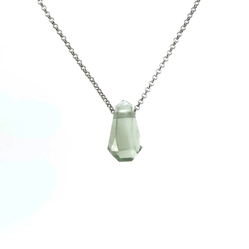 Necklace with a green crystal pendant on a white background