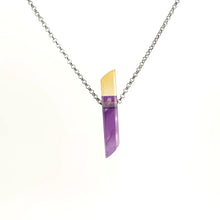 Neckless with amethyst and citrine intarsia on a white background