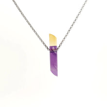 Neckless with amethyst and citrine intarsia on a white background