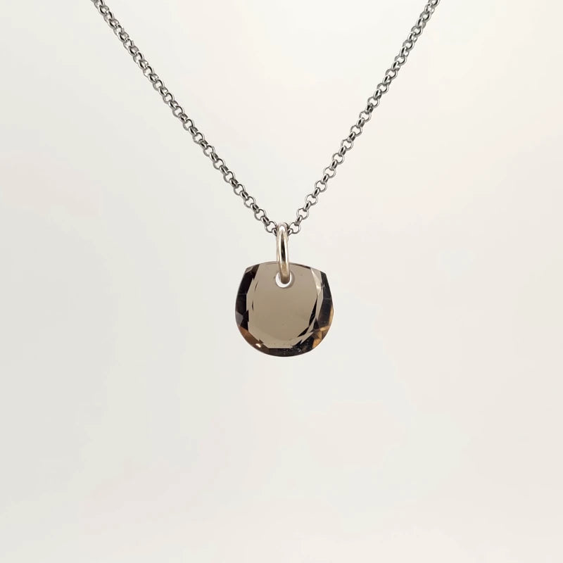 Necklace with a Smokey Quartz pendant featuring a faceted cut that enhances the stone’s deep, smoky brown tones, on a white background (back view)