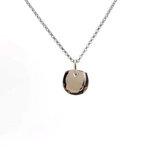 Necklace with a smoky quartz pendant on a white background