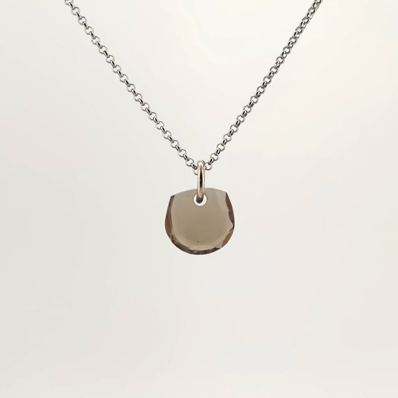Necklace with a Smokey Quartz pendant featuring a faceted cut that enhances the stone’s deep, smoky brown tones, on a white background (front view)