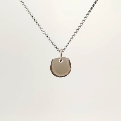 Necklace with a Smokey Quartz pendant featuring a faceted cut that enhances the stone’s deep, smoky brown tones, on a white background (front view)