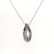 Necklace with a Oco Geode pendant featuring natural crystal-lined interiors within an agate shell, on a white background (front view)