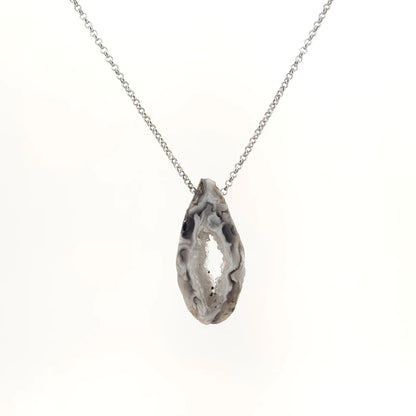 Necklace with a Oco Geode pendant featuring natural crystal-lined interiors within an agate shell, on a white background (front view)