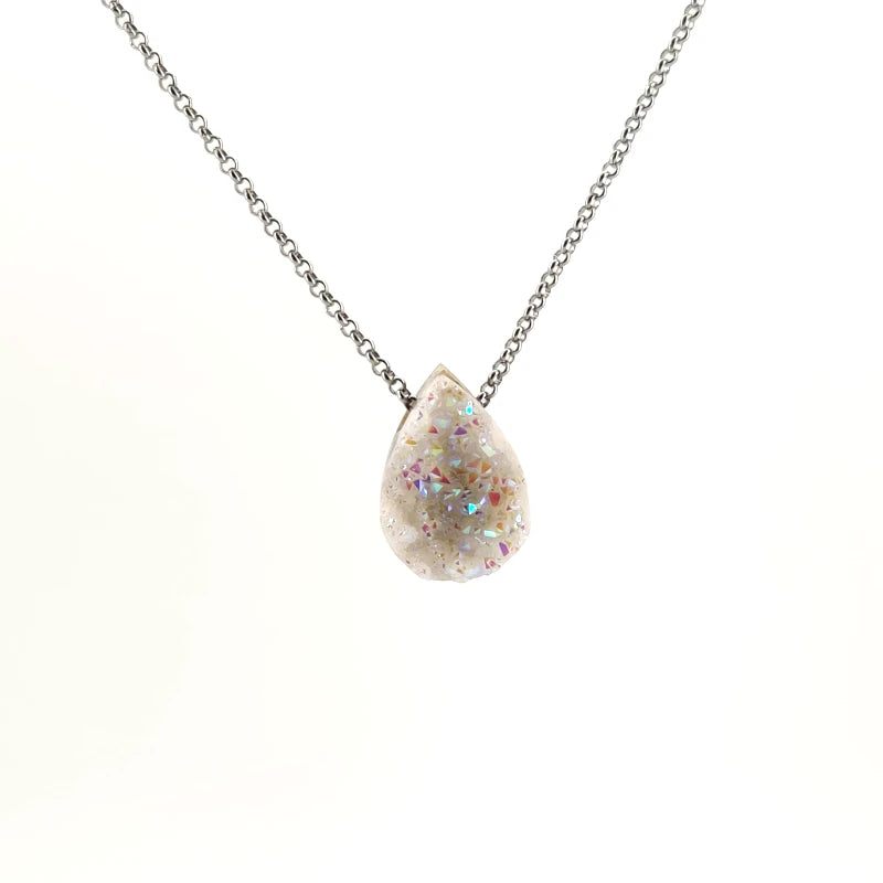 Necklace with a teardrop-shaped Angel Aura Treated Drusy pendant sparkles with a shimmering iridescent surface, on a white background (front view)