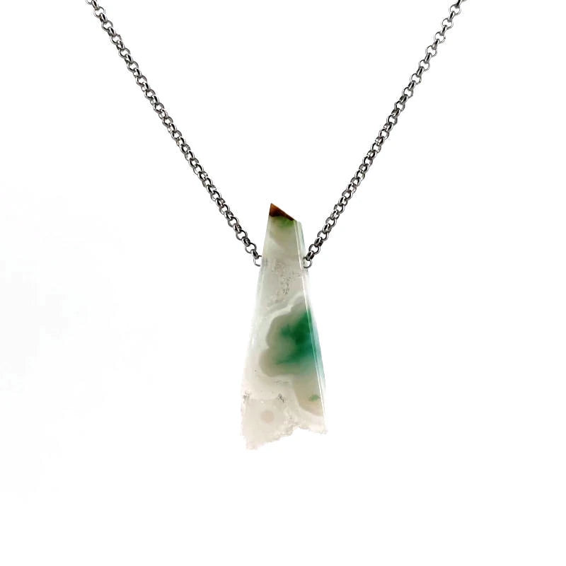 Necklace with a white agate pendant on a white background