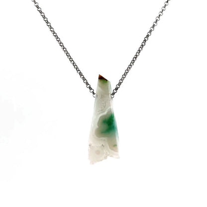 Necklace with a white agate pendant on a white background