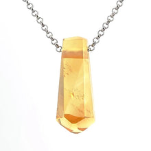 Crystal pendant necklace on a white background