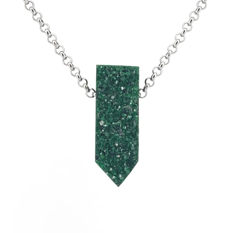 Necklace with a green drusy garnet pendant on a white background