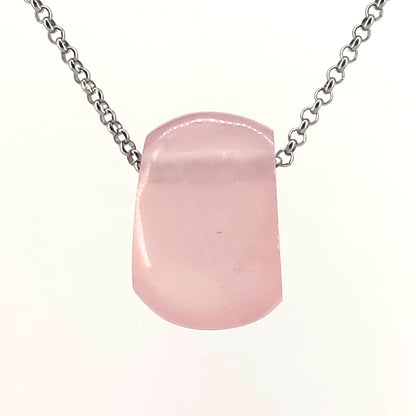Necklace with a rose quartz pendant on a white background