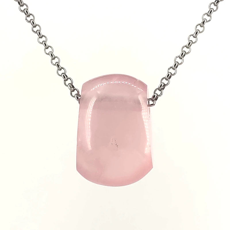 Necklace with a rose quartz pendant on a white background