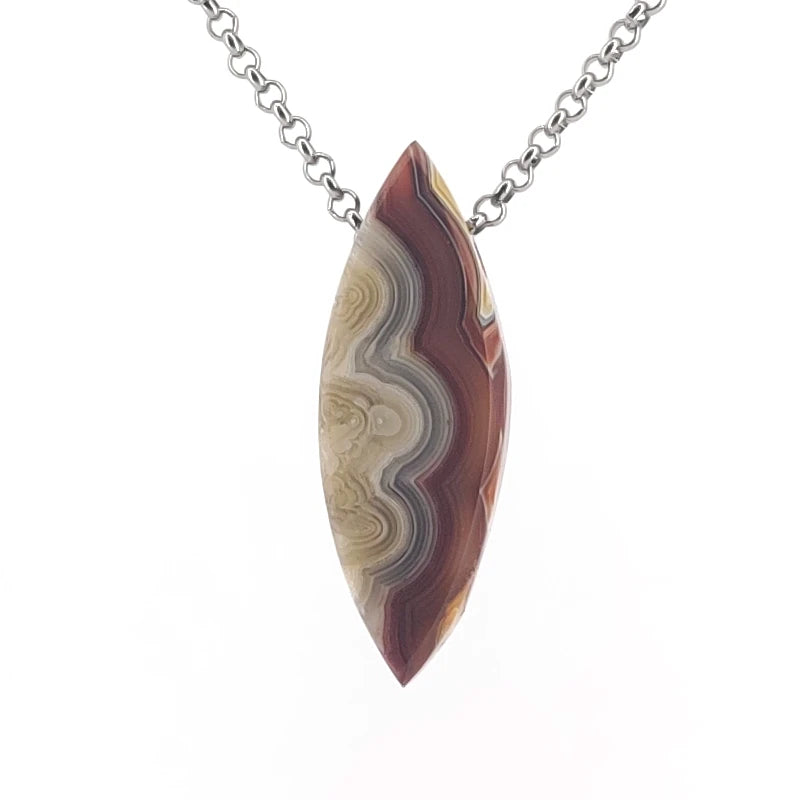 Necklace with a dryhead agate pendant on a white background