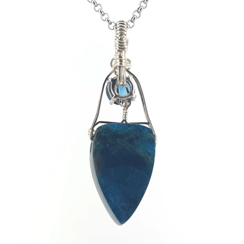 Necklace with apatite and blue topaz pendant on a white background
