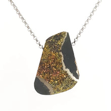 Necklace with a pyrite pendant on a white background